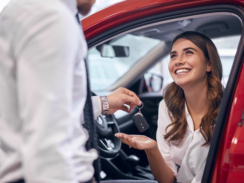 Customer receiving the keys to their car