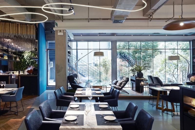 Modern restaurant interior with set tables